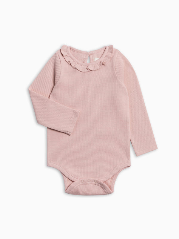 Mae Waffle Knit Ruffle Bodysuit - Petal Pink Baby : One Pieces : Bodysuits : Long Sleeves KENDI by Colored Organics Mae Waffle Knit Ruffle Bodysuit | Colored Organics®